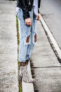 textured tights under jeans with leather jacket