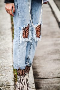 textured tights under jeans with leather jacket